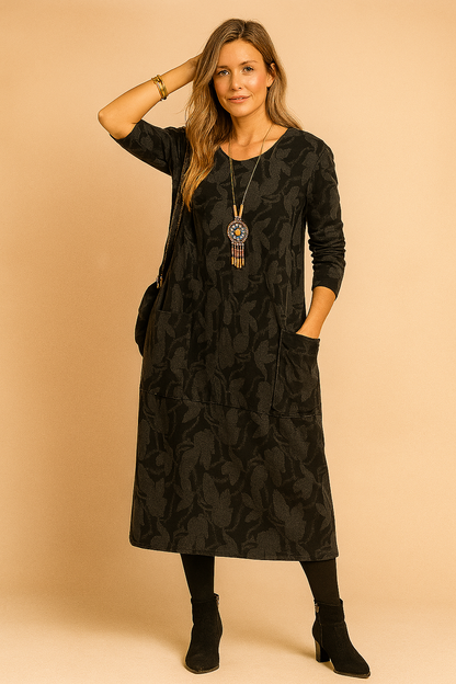A winter dress featuring long sleeves and pockets, designed for women's fashion. 2