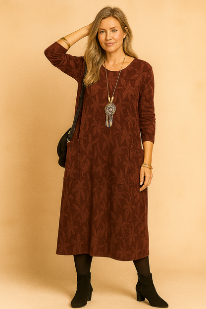 A winter dress featuring long sleeves and pockets, designed for women's fashion. 3