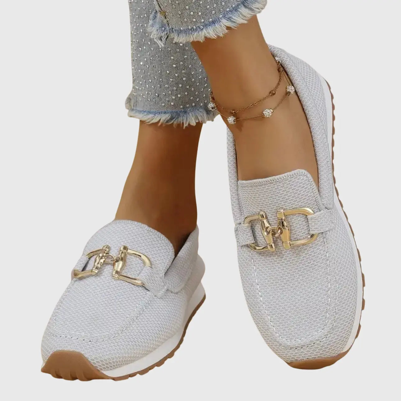 Orthopedic women's moccasins featuring metallic details and a non-slip sole. 7