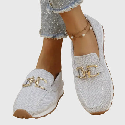 Orthopedic women's moccasins featuring metallic details and a non-slip sole. 7