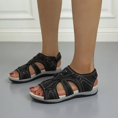 Orthopedic women's sandals with an open design, featuring adjustable straps and a cushioned footbed for comfort. 0