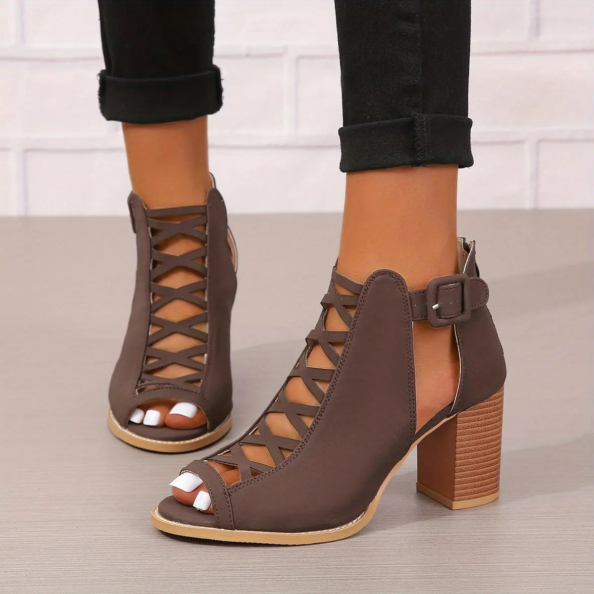 A pair of women's lace-up sandals with a block heel, featuring a strappy design and an open toe. 10