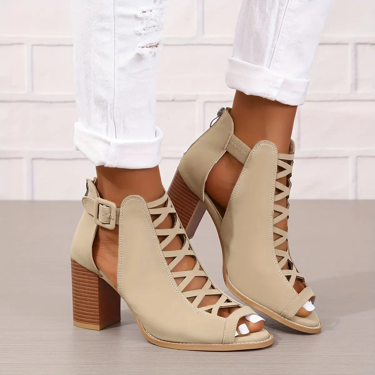 A pair of women's lace-up sandals with a block heel, featuring a strappy design and an open toe. 4