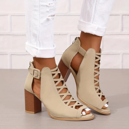 A pair of women's lace-up sandals with a block heel, featuring a strappy design and an open toe. 4