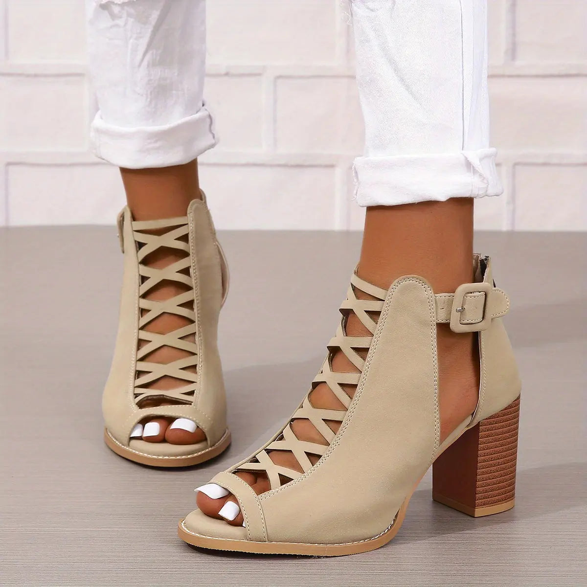 A pair of women's lace-up sandals with a block heel, featuring a strappy design and an open toe. 5