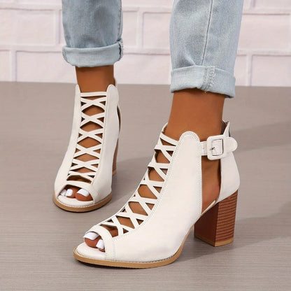 A pair of women's lace-up sandals with a block heel, featuring a strappy design and an open toe. 8