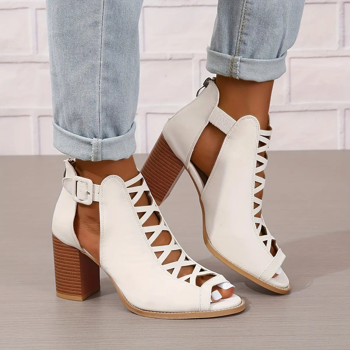 A pair of women's lace-up sandals with a block heel, featuring a strappy design and an open toe. 9