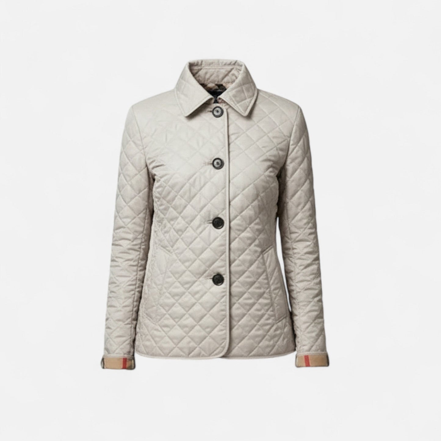 A women's winter jacket featuring an insulated design and a stylish collar, showcased on a mannequin against a neutral background. 0