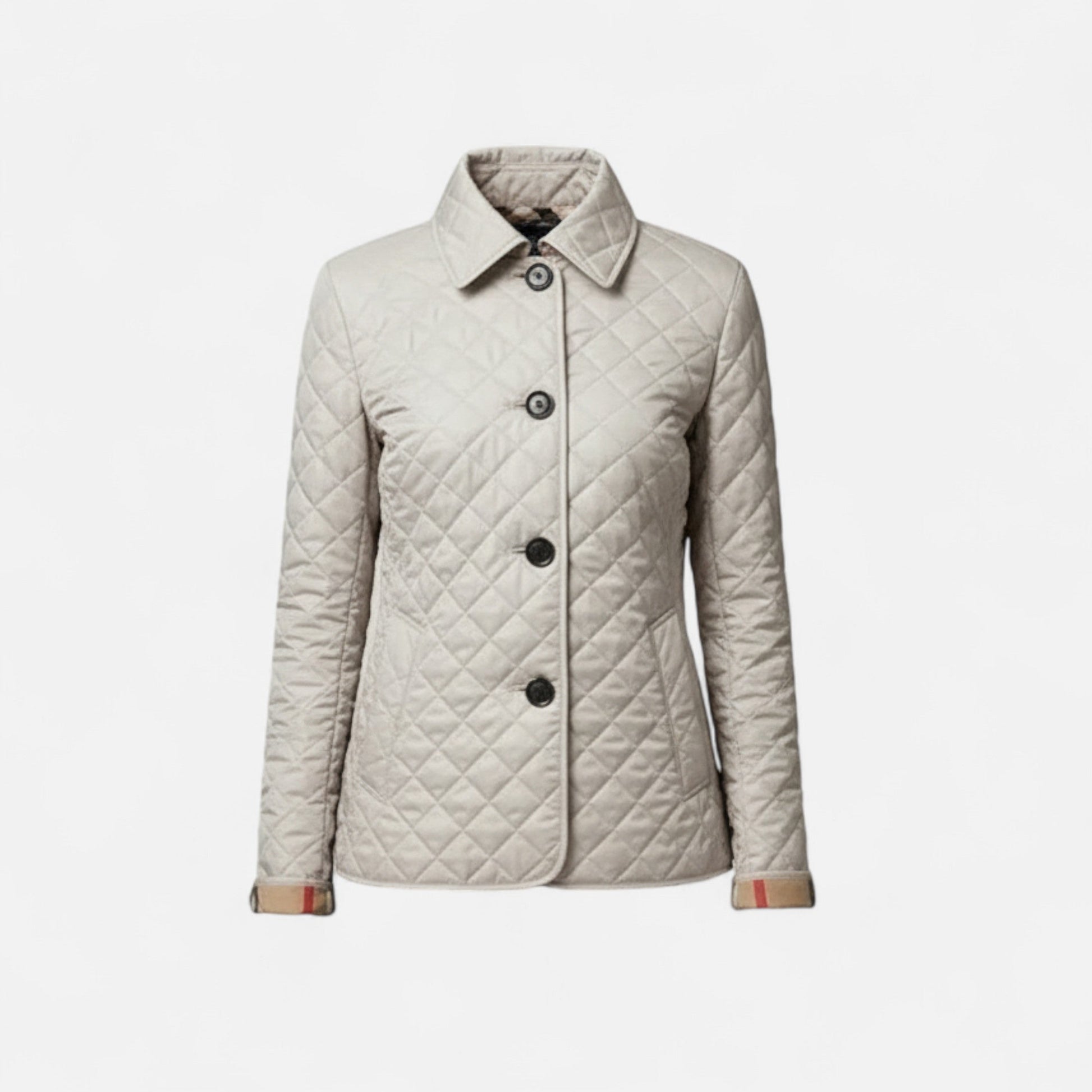 A women's winter jacket featuring an insulated design and a stylish collar, showcased on a mannequin against a neutral background. 0