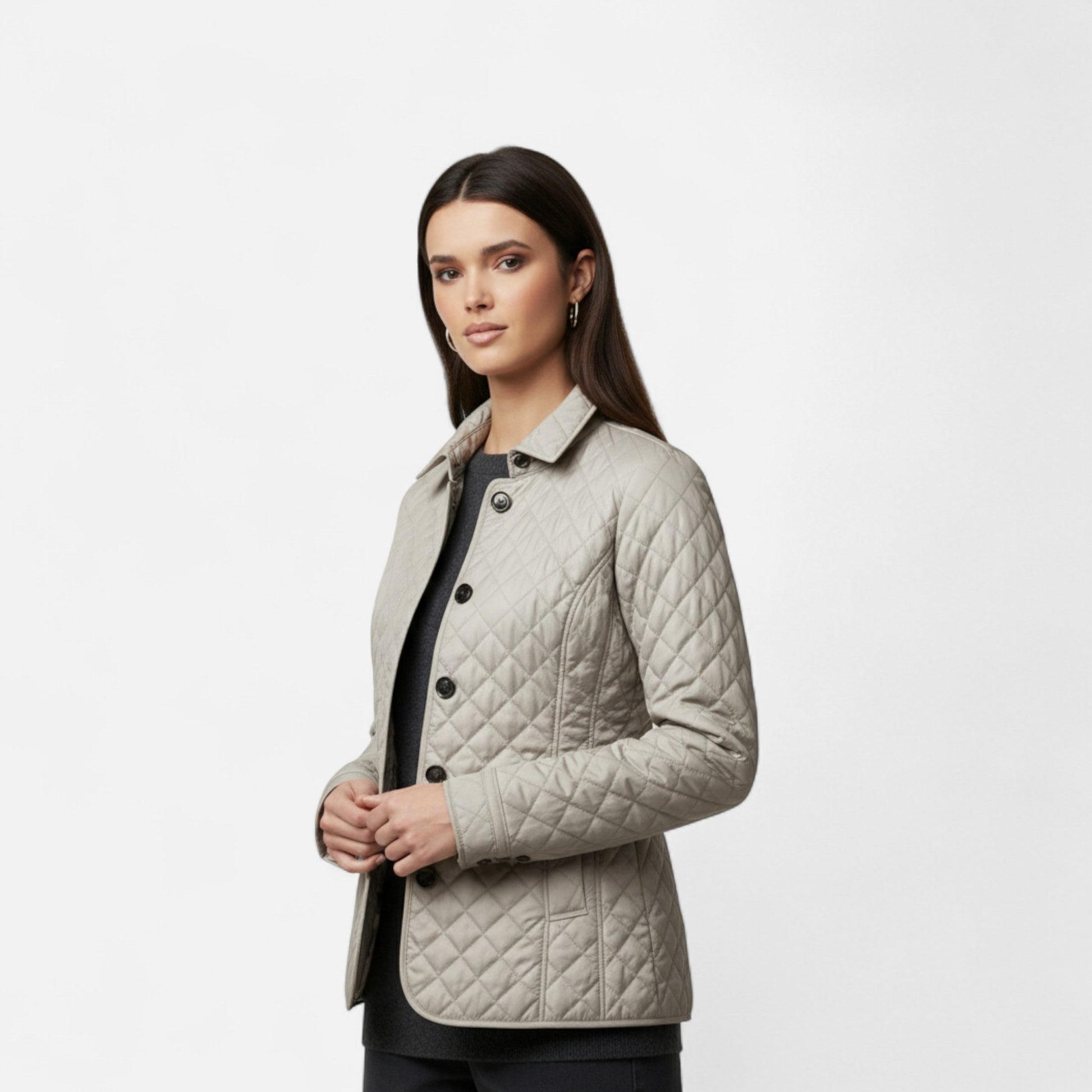 A women's winter jacket featuring an insulated design and a stylish collar, showcased on a mannequin against a neutral background. 1