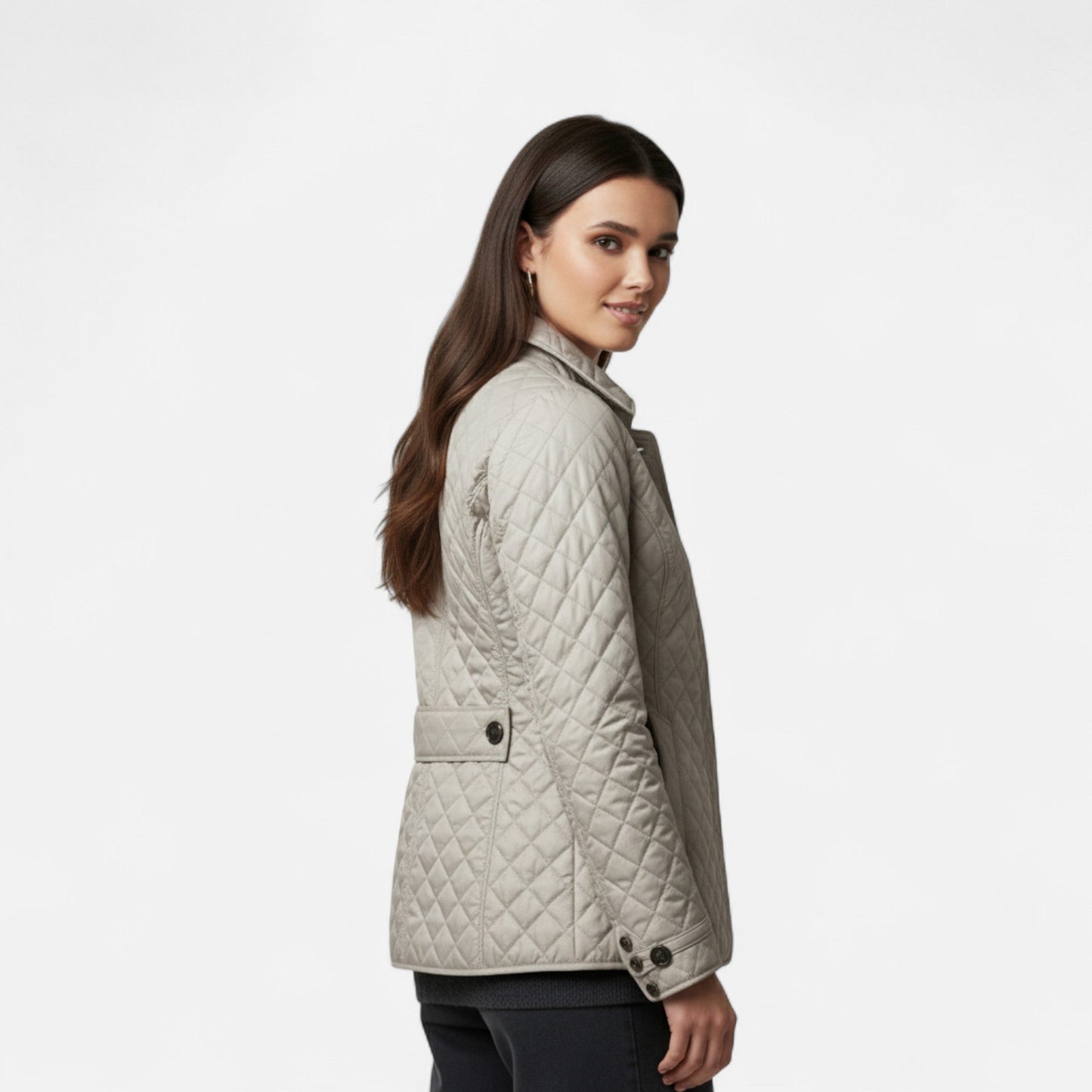 A women's winter jacket featuring an insulated design and a stylish collar, showcased on a mannequin against a neutral background. 3