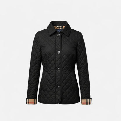 A women's winter jacket featuring an insulated design and a stylish collar, showcased on a mannequin against a neutral background. 4