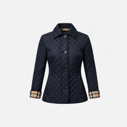 A women's winter jacket featuring an insulated design and a stylish collar, showcased on a mannequin against a neutral background. 6