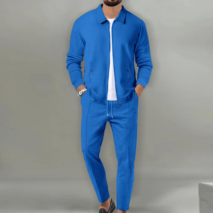 Men's beige blazer and pants set with a zipper closure, displayed on a neutral background. The blazer features a classic cut with lapels, while the 4