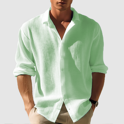 Men's long-sleeve white classic shirt displayed on a hanger, featuring a button-down collar and a straight cut. 2
