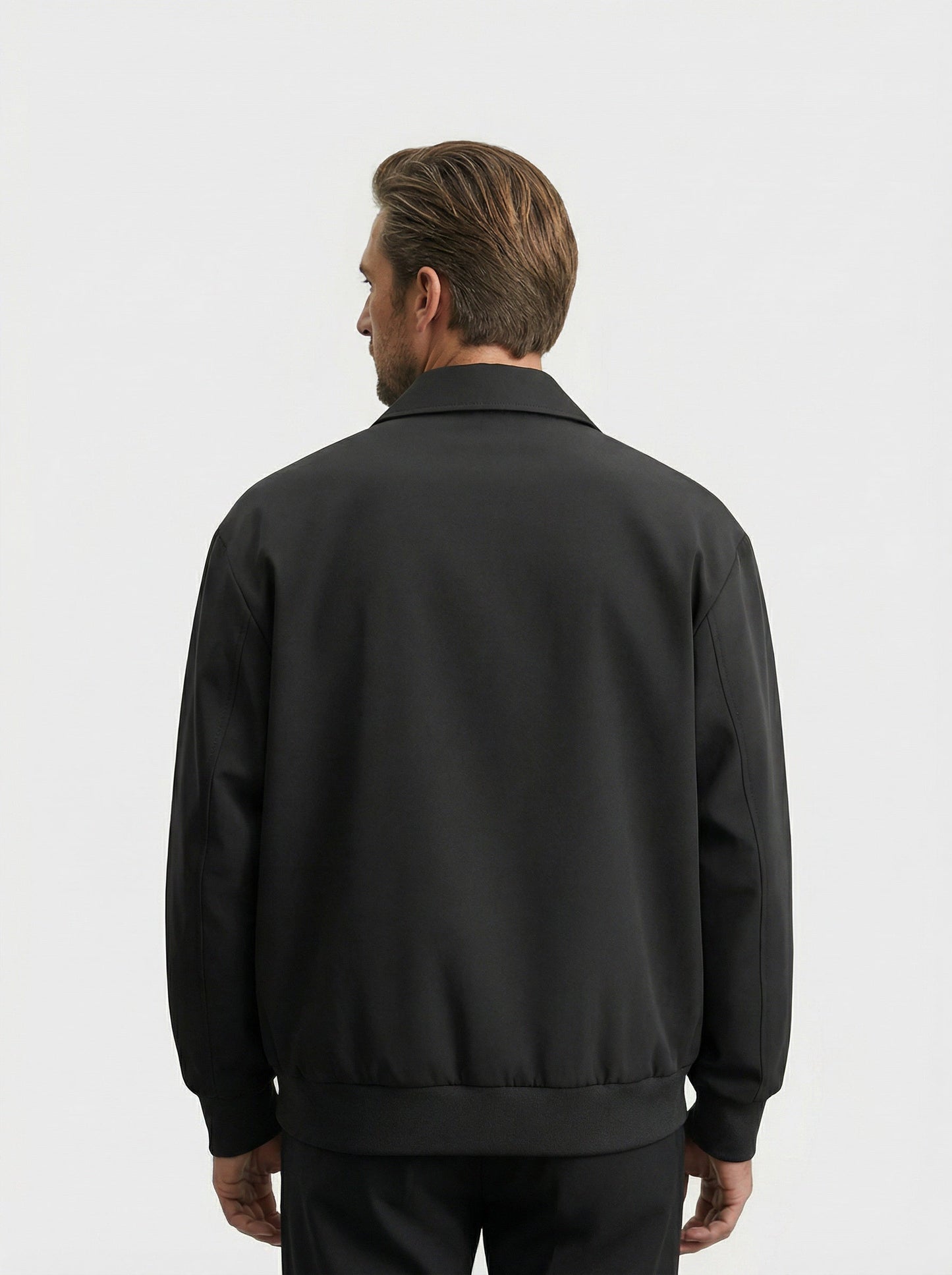 Men's bomber jacket featuring a zip closure and ribbed cuffs. 1