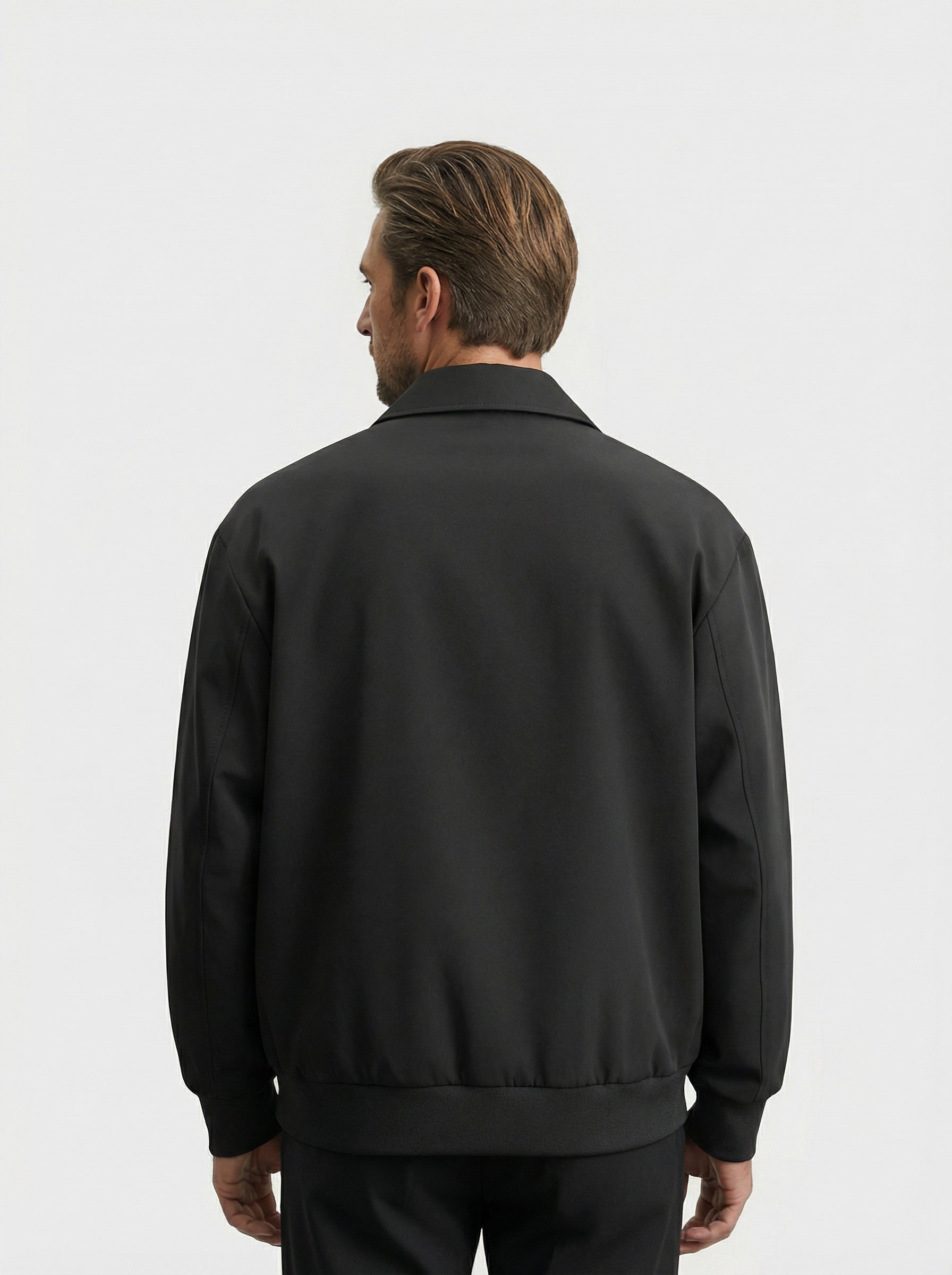 Men's bomber jacket featuring a zip closure and ribbed cuffs. 1