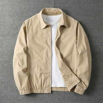 Men's lightweight jacket featuring a zip closure and elastic cuffs. 0