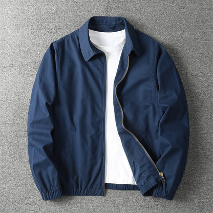 Men's lightweight jacket featuring a zip closure and elastic cuffs. 2