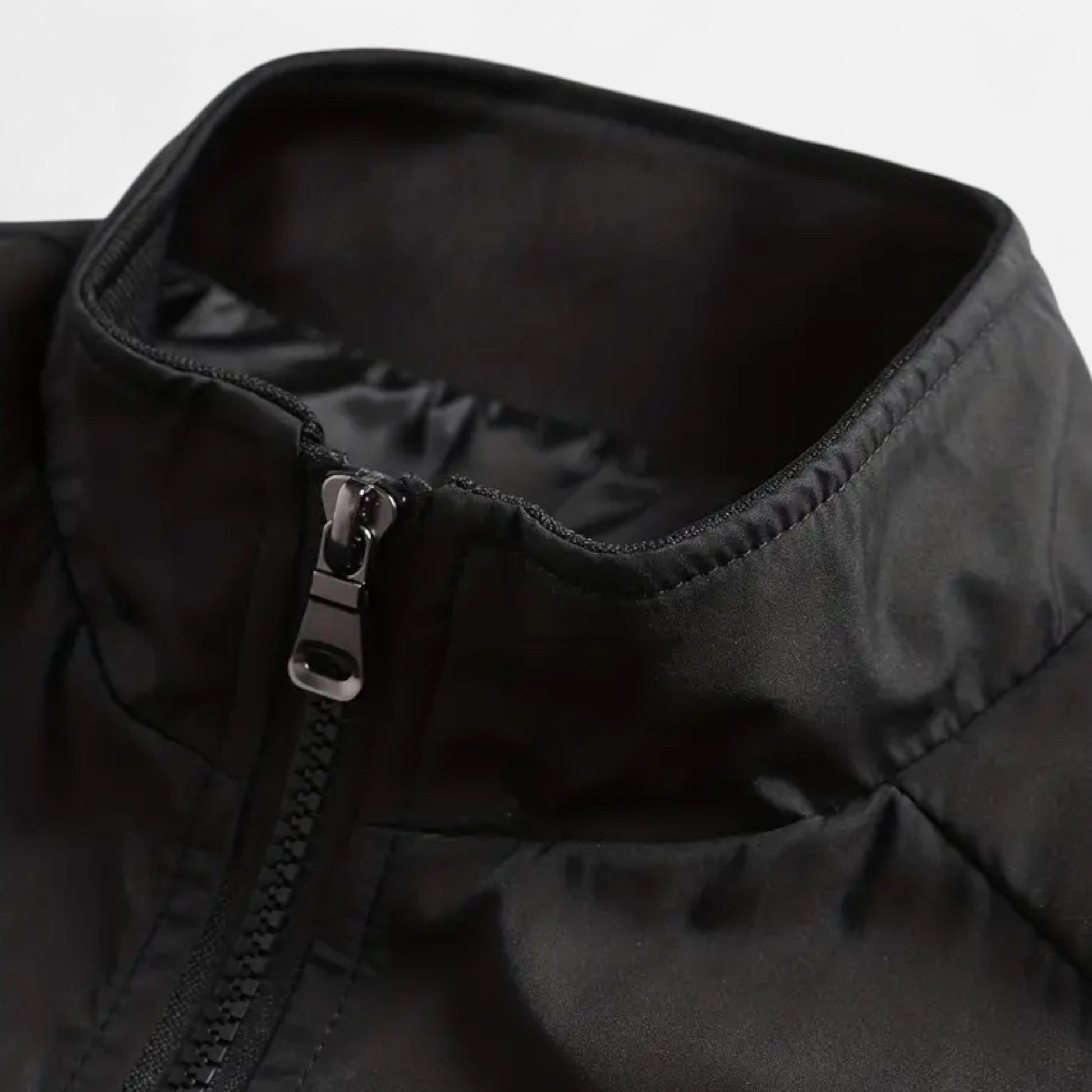 Men's lightweight jacket featuring a high collar and a zip closure. 3