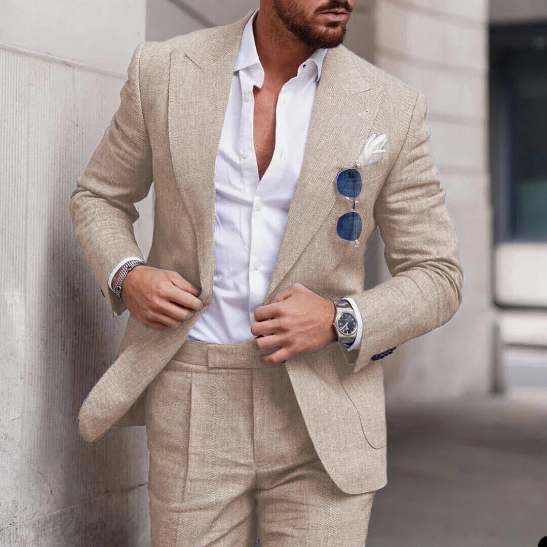 Men's two-piece wedding suit featuring a single-breasted jacket with open lapels and tailored trousers. 0