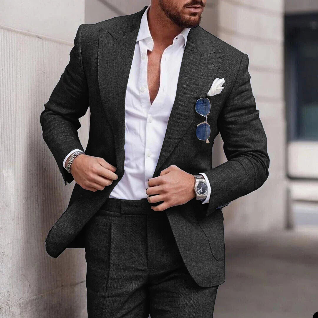 Men's two-piece wedding suit featuring a single-breasted jacket with open lapels and tailored trousers. 3