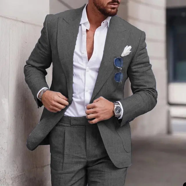 Men's two-piece wedding suit featuring a single-breasted jacket with open lapels and tailored trousers. 9