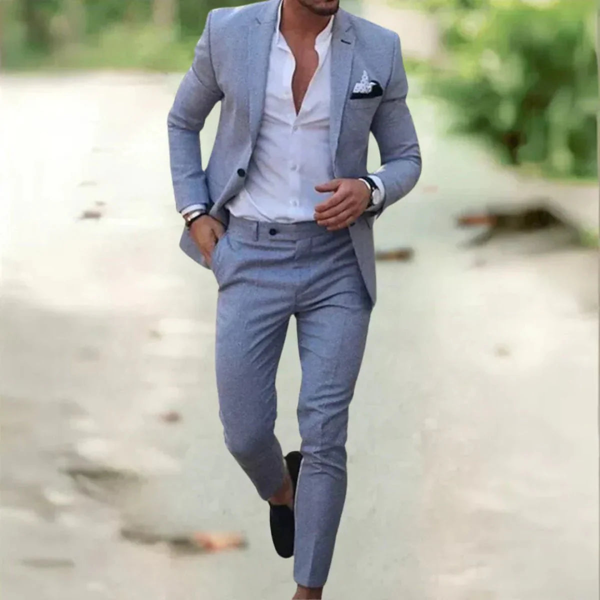 Men's classic black wedding suit with a tailored fit, featuring a jacket with notched lapels and matching trousers. 1