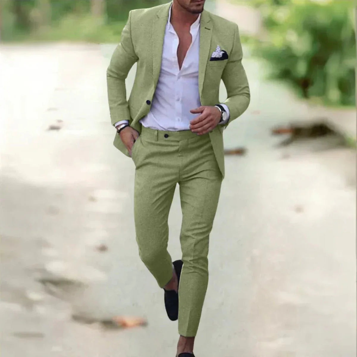 Men's classic black wedding suit with a tailored fit, featuring a jacket with notched lapels and matching trousers. 2