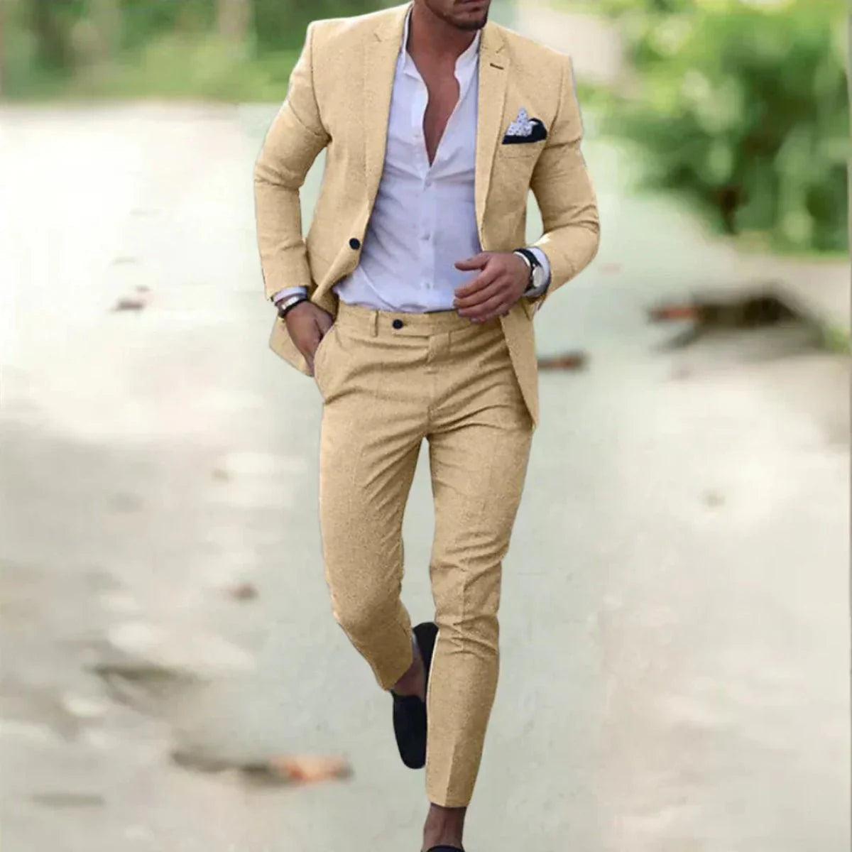 Men's classic black wedding suit with a tailored fit, featuring a jacket with notched lapels and matching trousers. 3