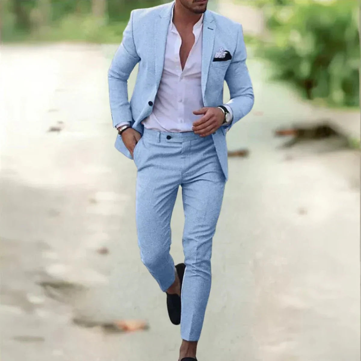 Men's classic black wedding suit with a tailored fit, featuring a jacket with notched lapels and matching trousers. 4