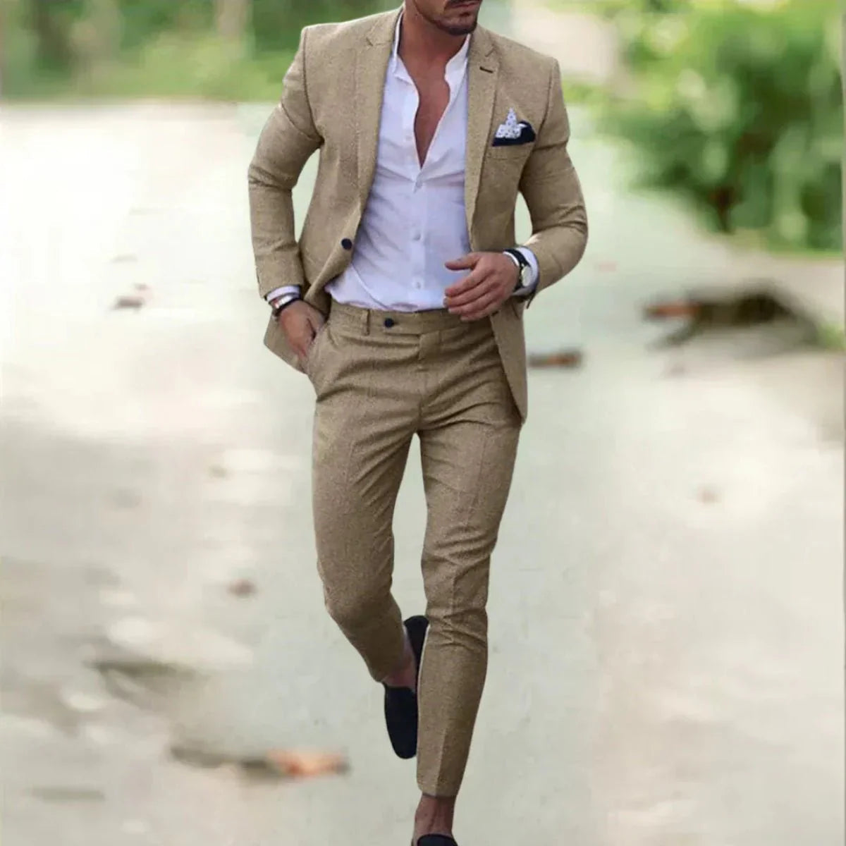 Men's classic black wedding suit with a tailored fit, featuring a jacket with notched lapels and matching trousers. 5