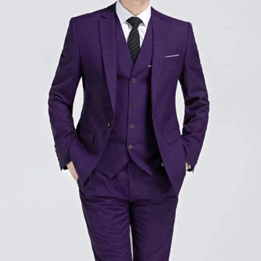 Men's classic three-piece suit displayed on a hanger, featuring a tailored jacket, matching vest, and trousers, arranged neatly for a spring presentation. 0