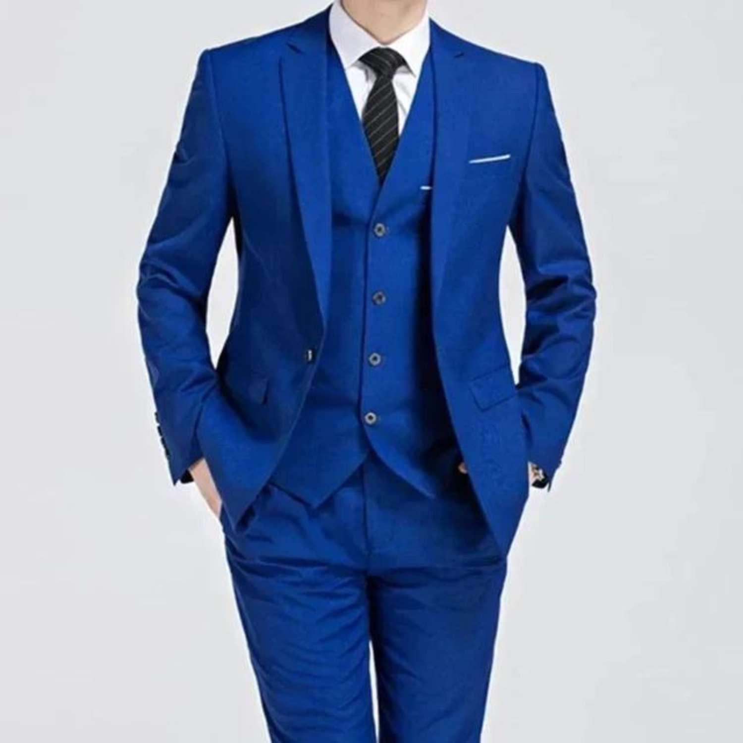 Men's classic three-piece suit displayed on a hanger, featuring a tailored jacket, matching vest, and trousers, arranged neatly for a spring presentation. 2