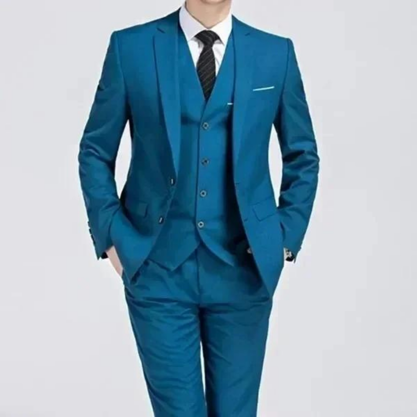 Men's classic three-piece suit displayed on a hanger, featuring a tailored jacket, matching vest, and trousers, arranged neatly for a spring presentation. 3