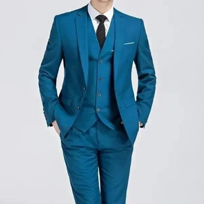 Men's classic three-piece suit displayed on a hanger, featuring a tailored jacket, matching vest, and trousers, arranged neatly for a spring presentation. 3