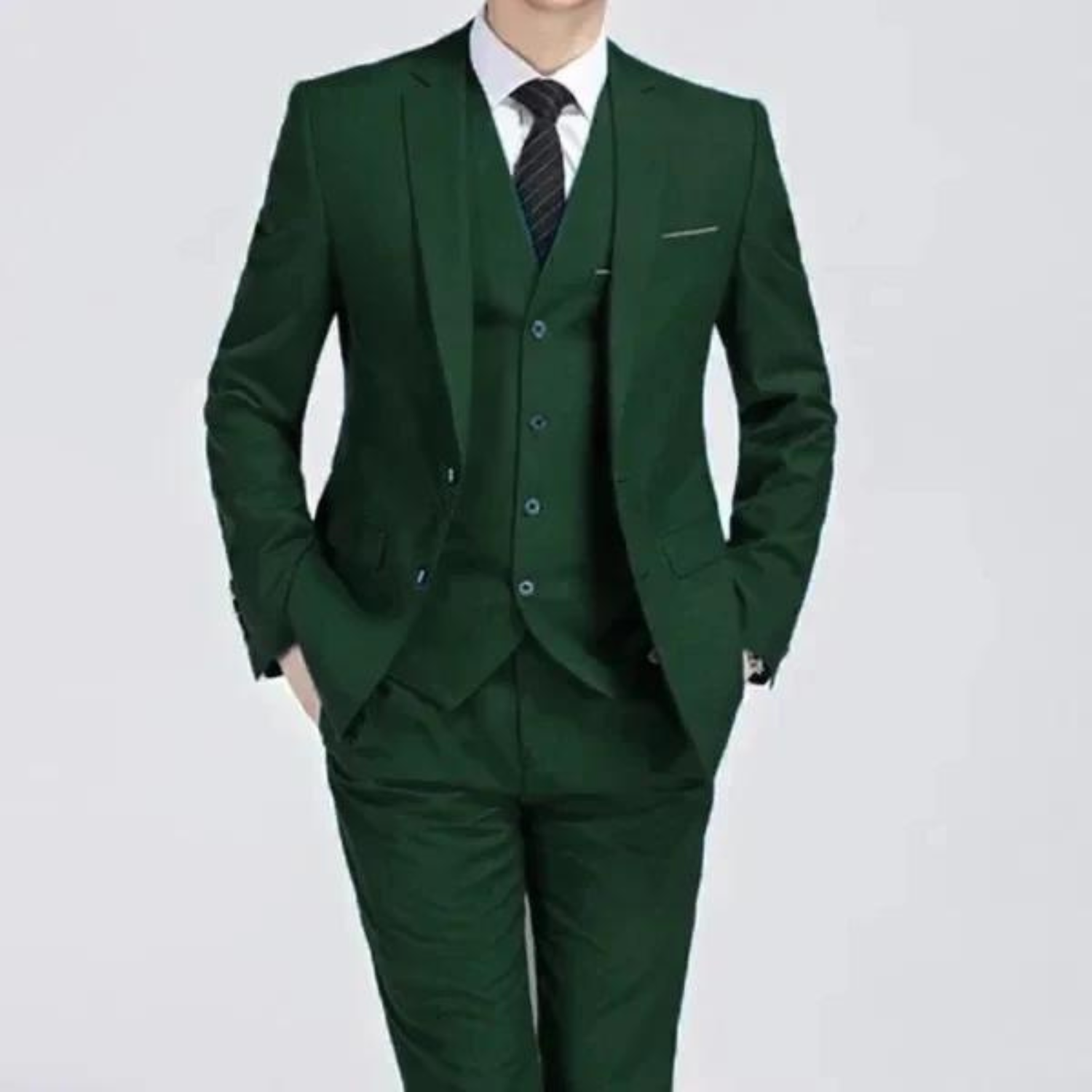 Men's classic three-piece suit displayed on a hanger, featuring a tailored jacket, matching vest, and trousers, arranged neatly for a spring presentation. 4