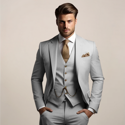 Men's three-piece formal suit displayed on a hanger, featuring a tailored jacket, matching trousers, and a waistcoat, set against a neutral background. 2