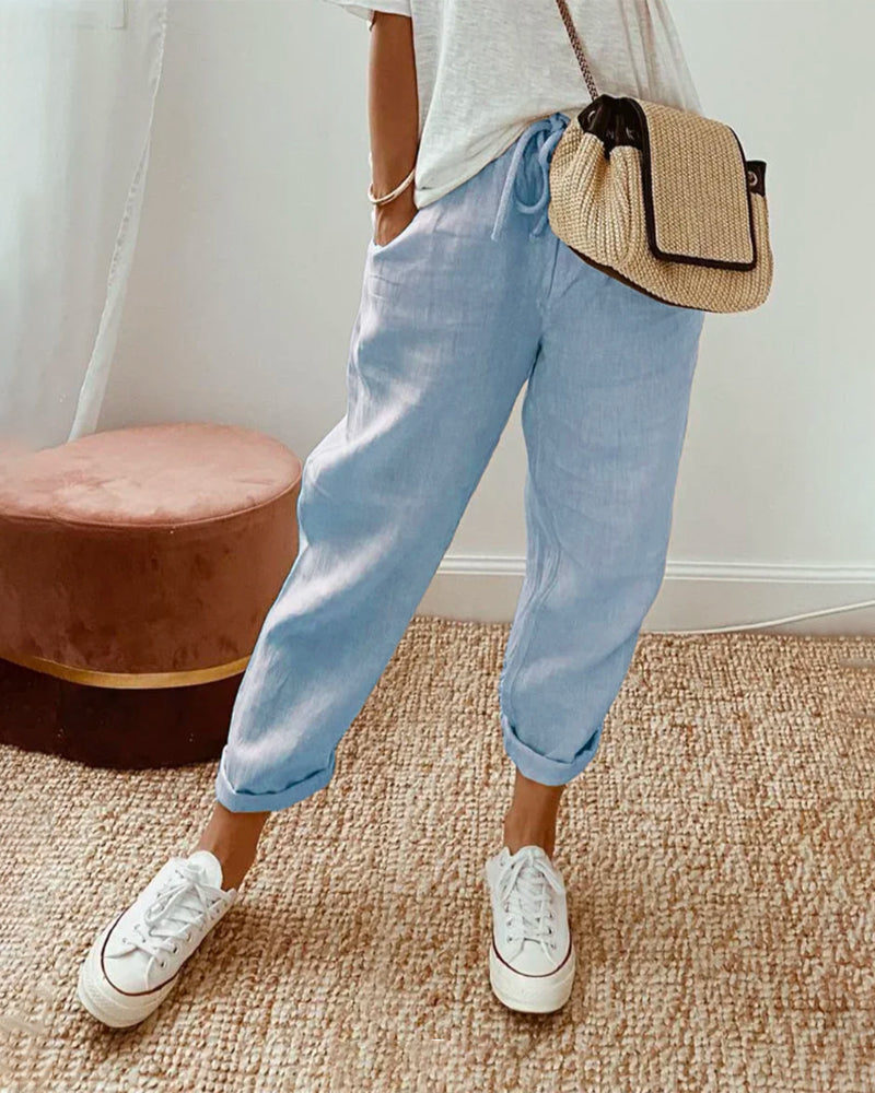 Men's casual long pants with pockets in a regular fit, displayed on a flat surface. 2