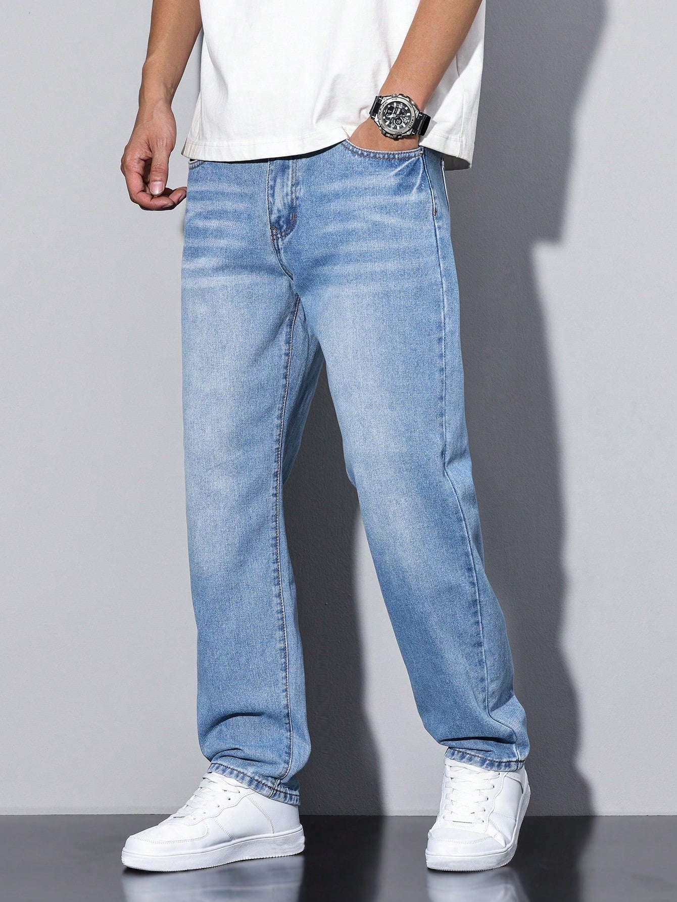 Men's loose-fitting jeans with straight legs in a solid color, displayed flat on a white background. 6