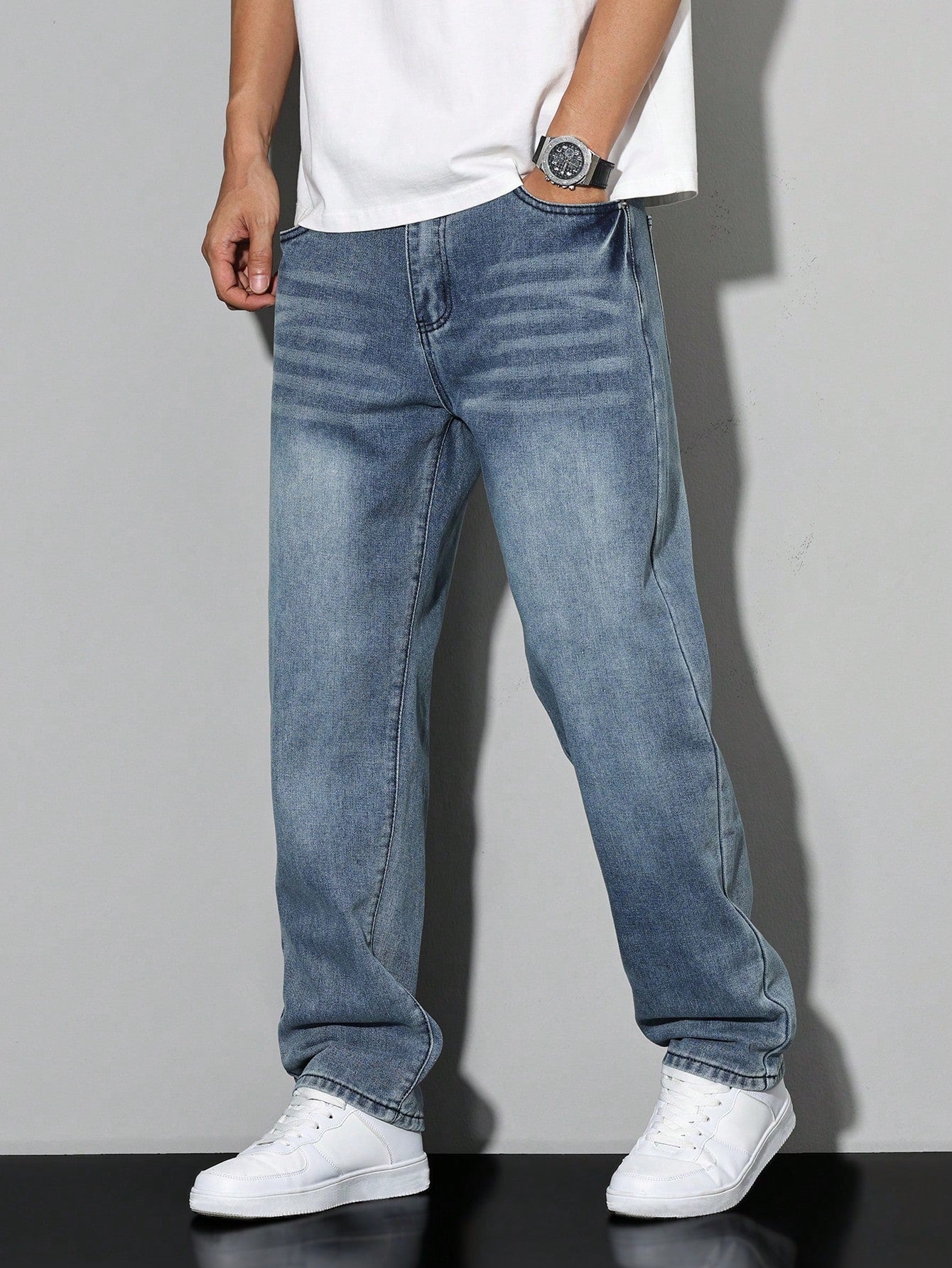 Men's loose-fitting jeans with straight legs in a solid color, displayed flat on a white background. 8