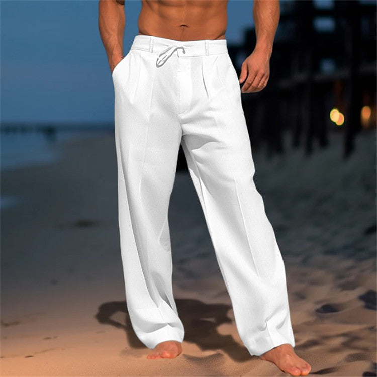 Men's loose spring trousers with an adjustable waist, displayed hanging on a wooden hanger against a neutral background. 0