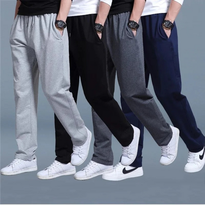 Men's sweatpants with wide legs and an elastic waistband, displayed on a neutral background. 1