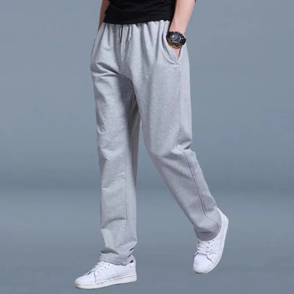 Men's sweatpants with wide legs and an elastic waistband, displayed on a neutral background. 2