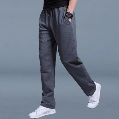 Men's sweatpants with wide legs and an elastic waistband, displayed on a neutral background. 4