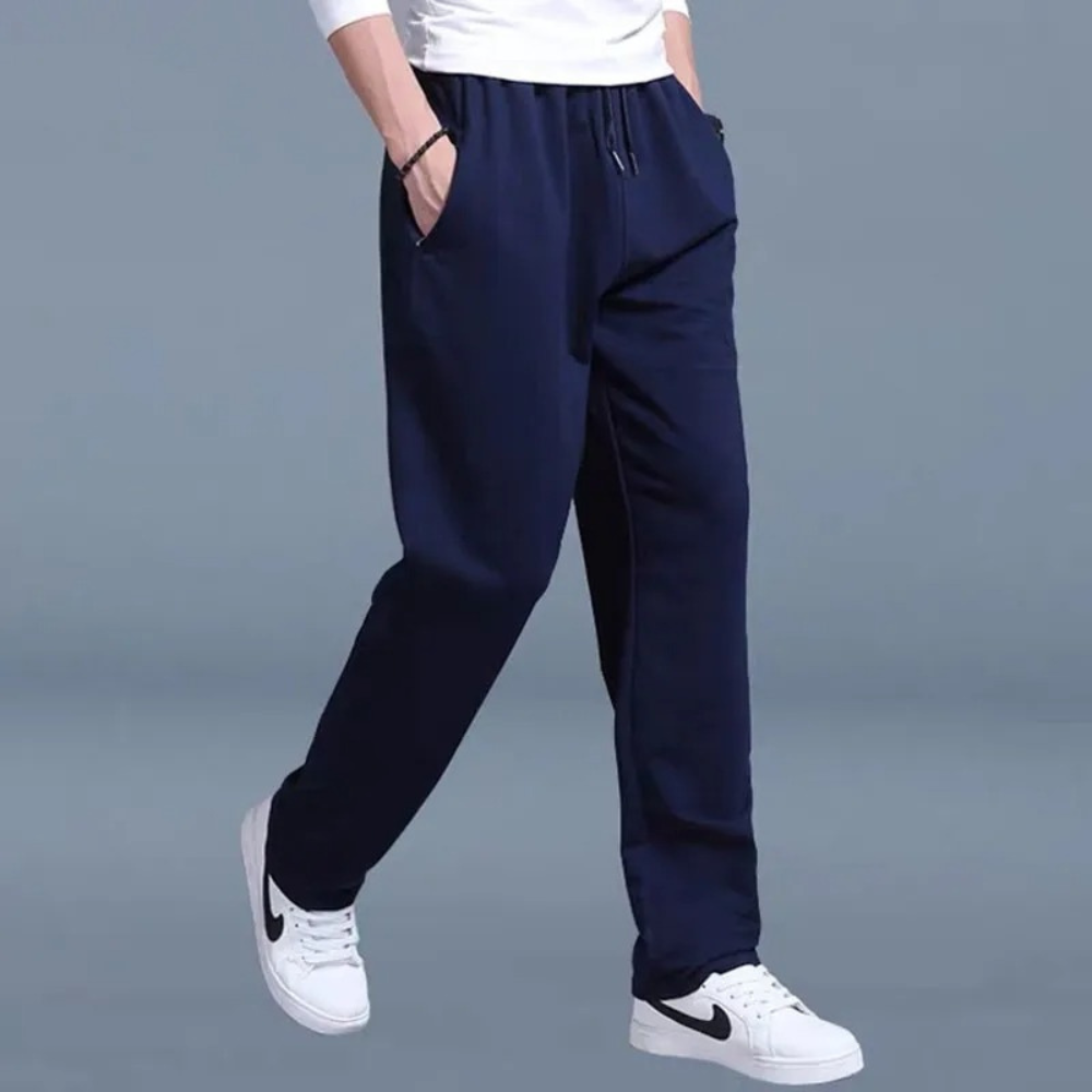 Men's sweatpants with wide legs and an elastic waistband, displayed on a neutral background. 6
