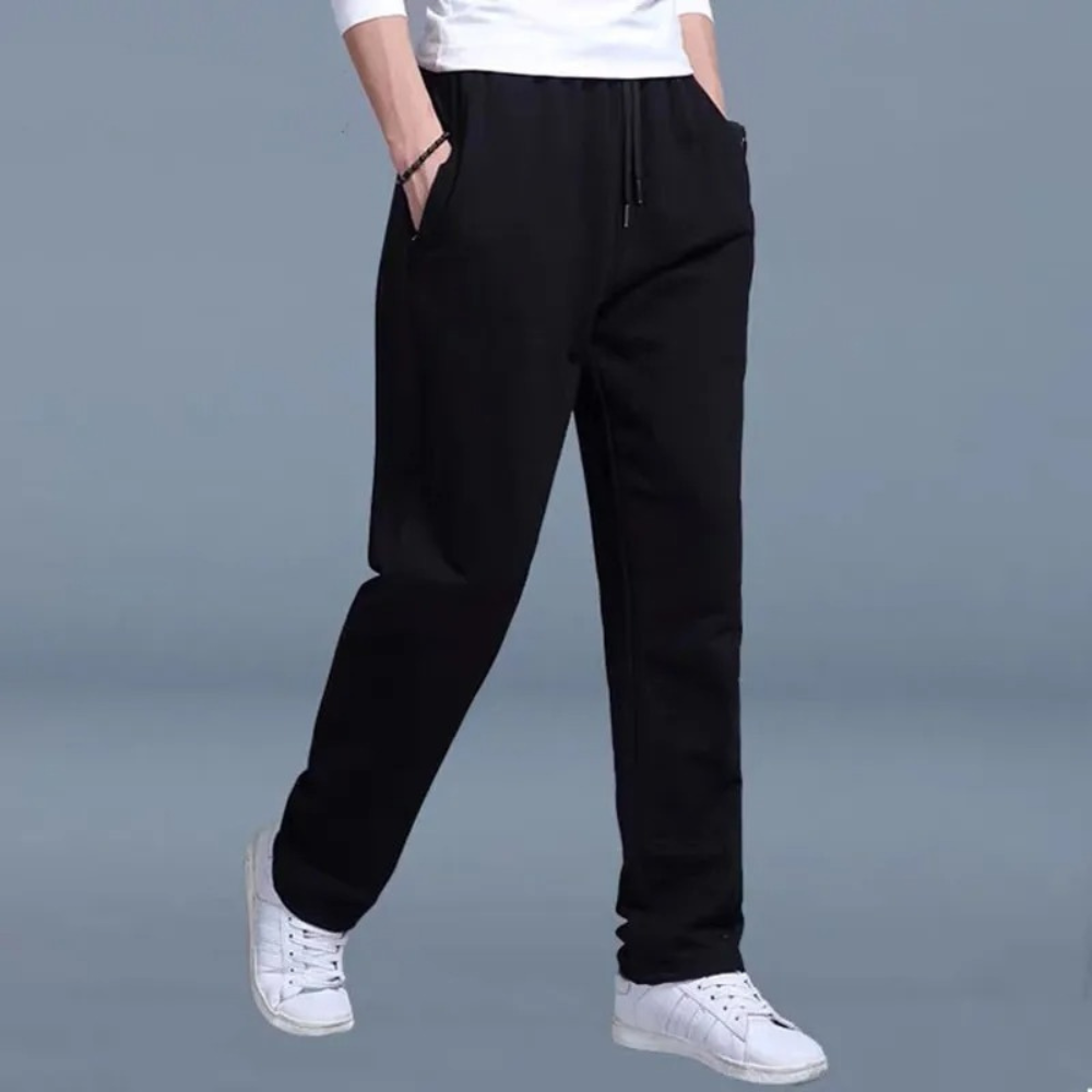 Men's sweatpants with wide legs and an elastic waistband, displayed on a neutral background. 8