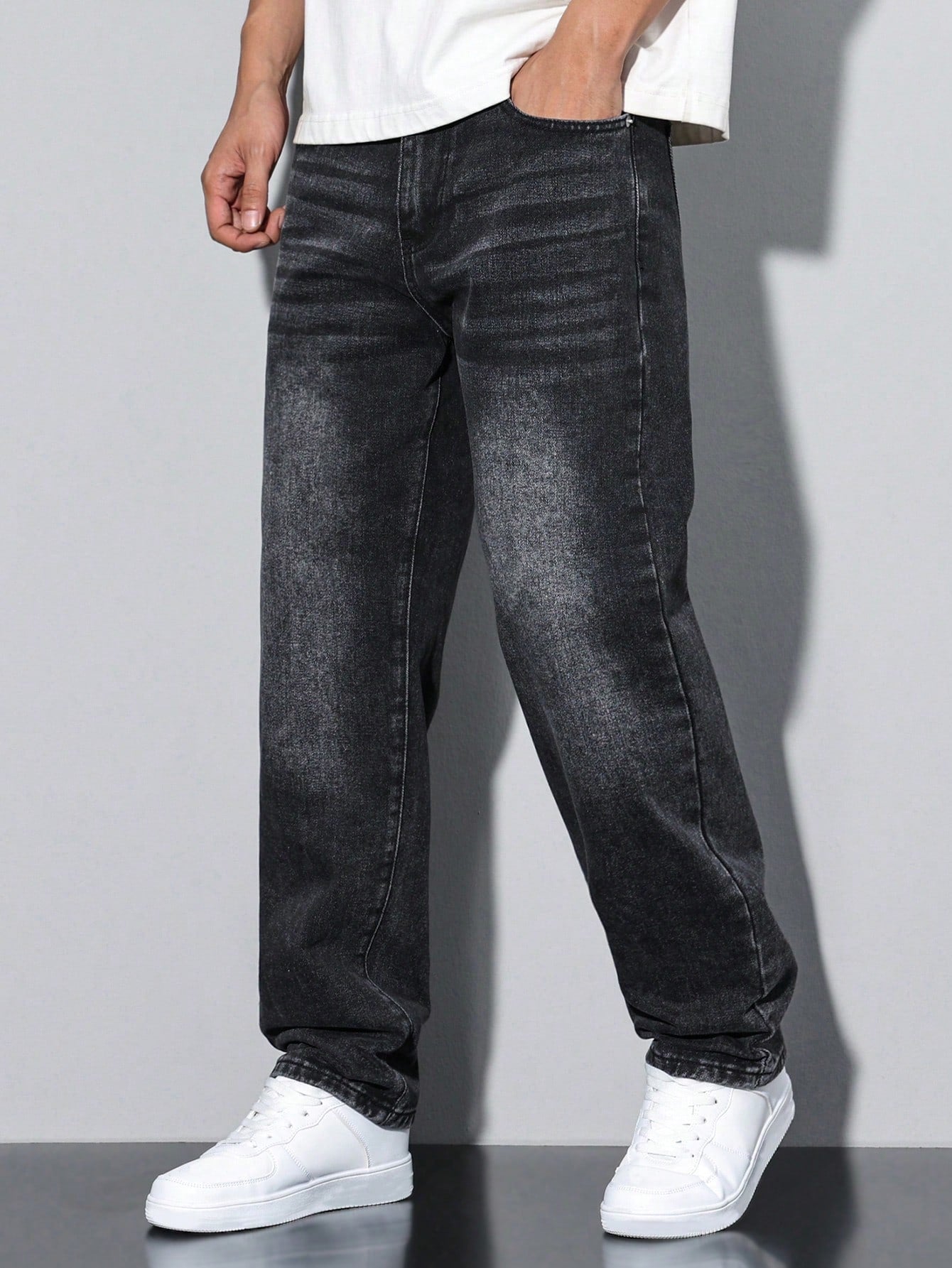 Men's casual straight-leg jeans with a distressed look. 2