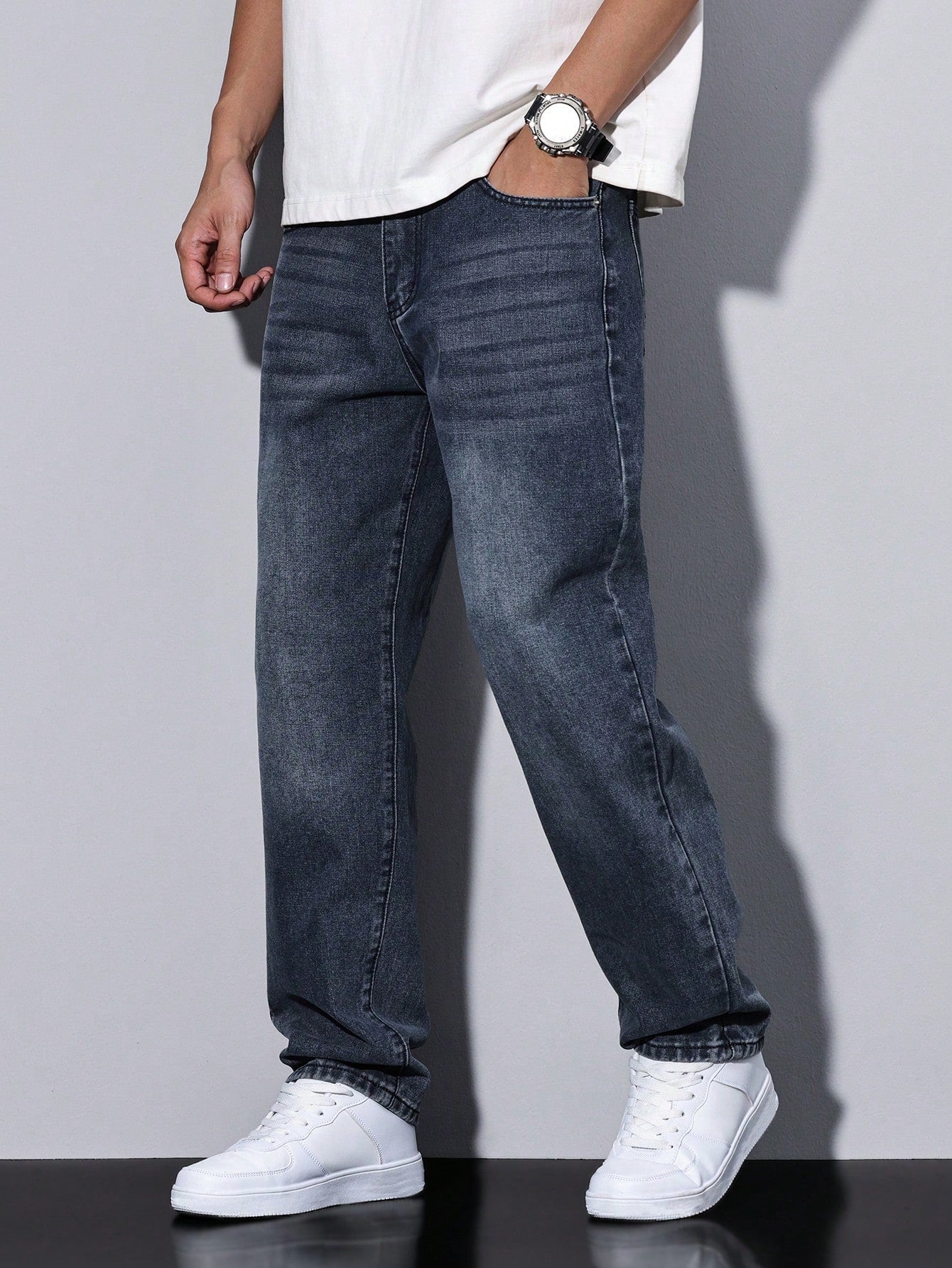 Men's casual straight-leg jeans with a distressed look. 4
