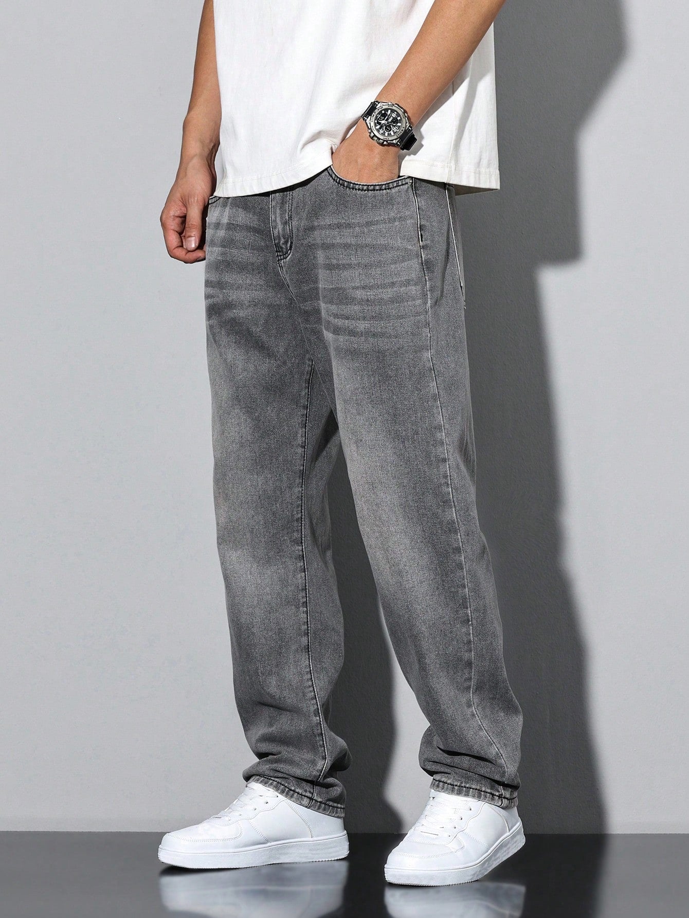 Men's casual straight-leg jeans with a distressed look. 7